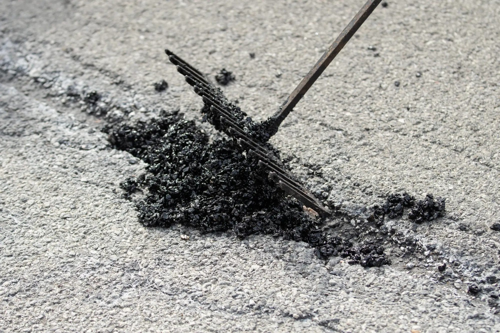 tar filled a crack in the road